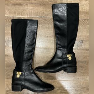 Michael Kors Black leather stretch boots with gold lock emblem